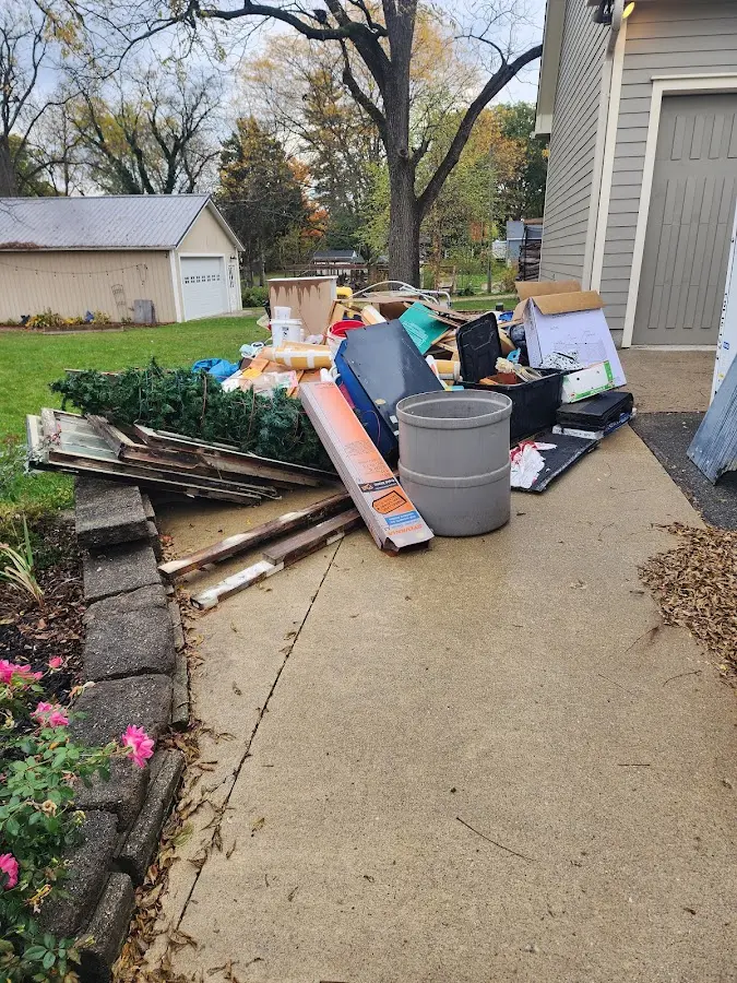 Dumpster being loaded with debris for Estate Cleanout Dumpster Rental in Hoosick Falls
